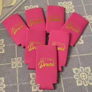 Seven unused koozies